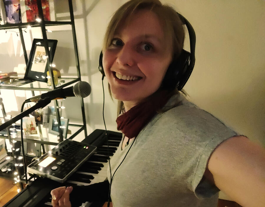 a picture of a normal human, smiling, who is definitely not three possums in a trenchcoat